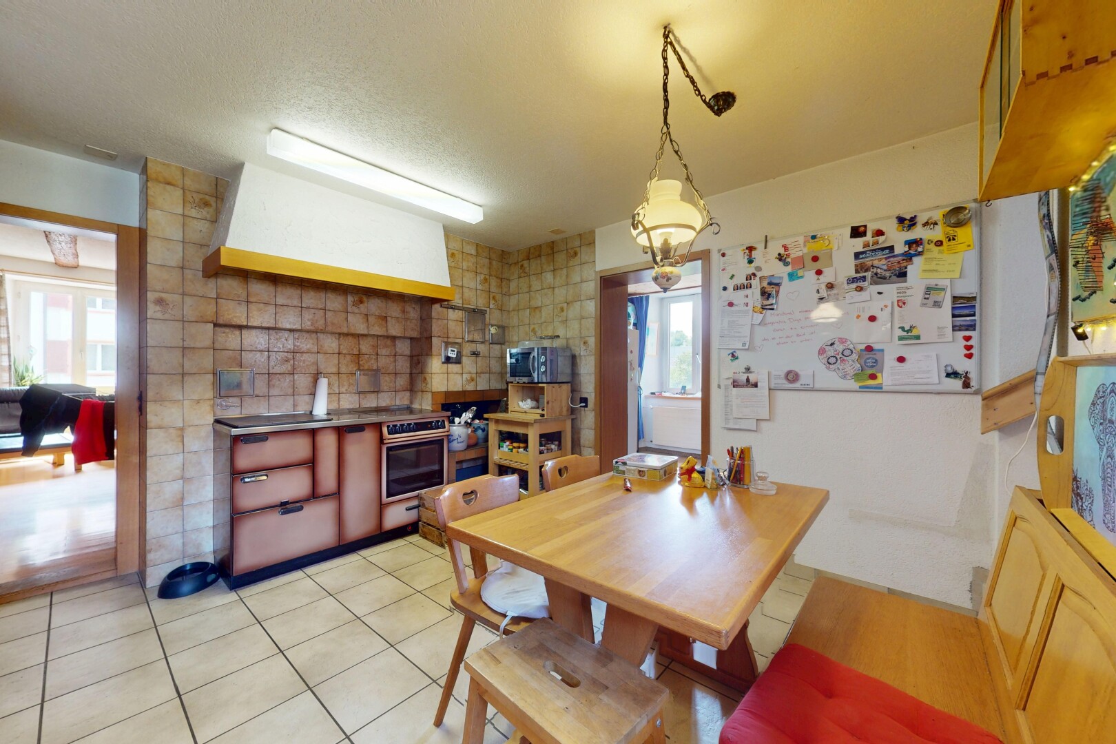 dining room featuring light tile patterned floors and a textured ceiling
