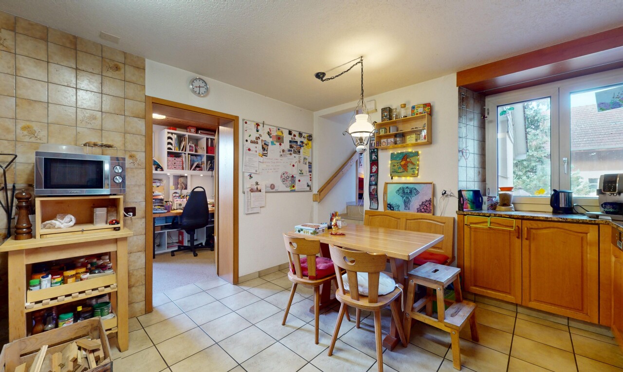 dining room featuring light tile patterned floors and an office area