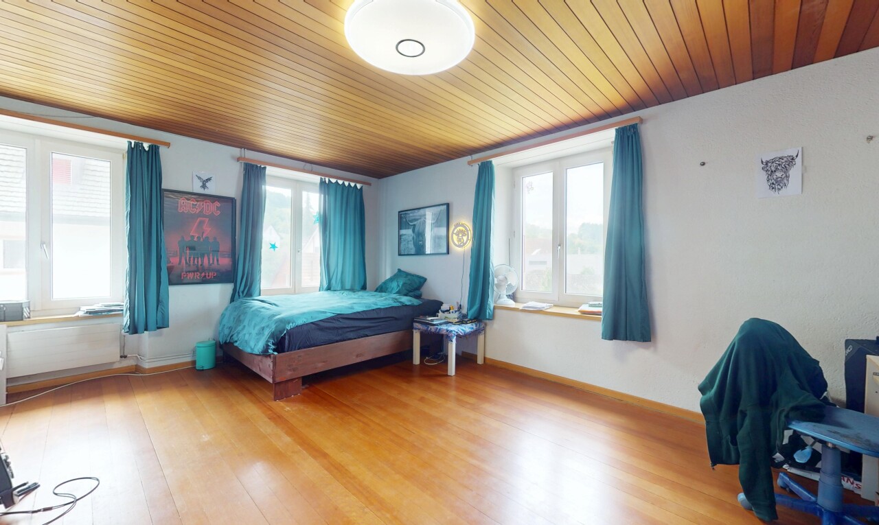 room / bedroom featuring light wood-style floors and wood ceiling