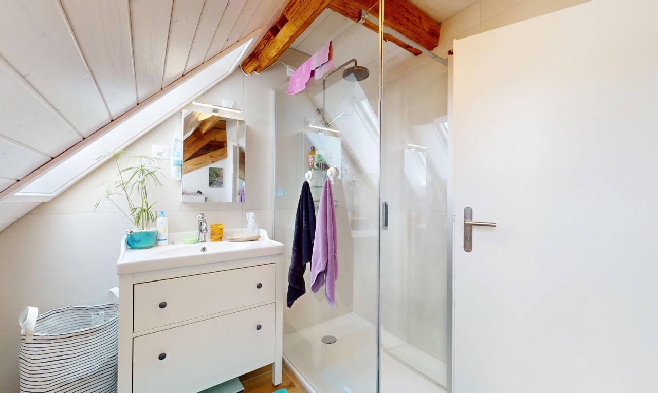 bathroom featuring vanity and a stall shower