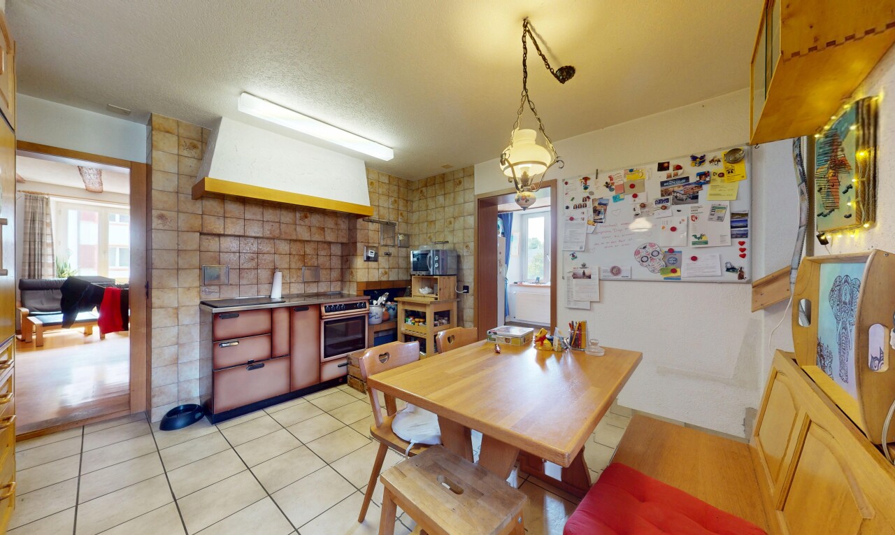 dining room featuring light tile patterned floors and a textured ceiling