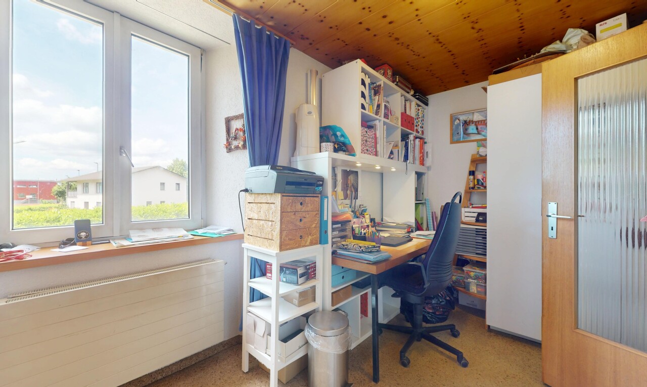 room / bedroom with radiator and an office area
