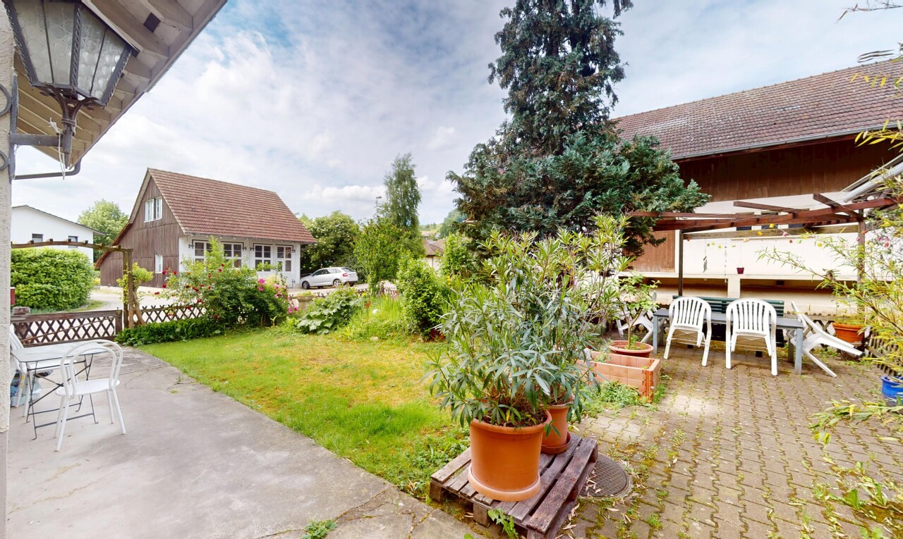 garden with a patio area and outdoor dining area