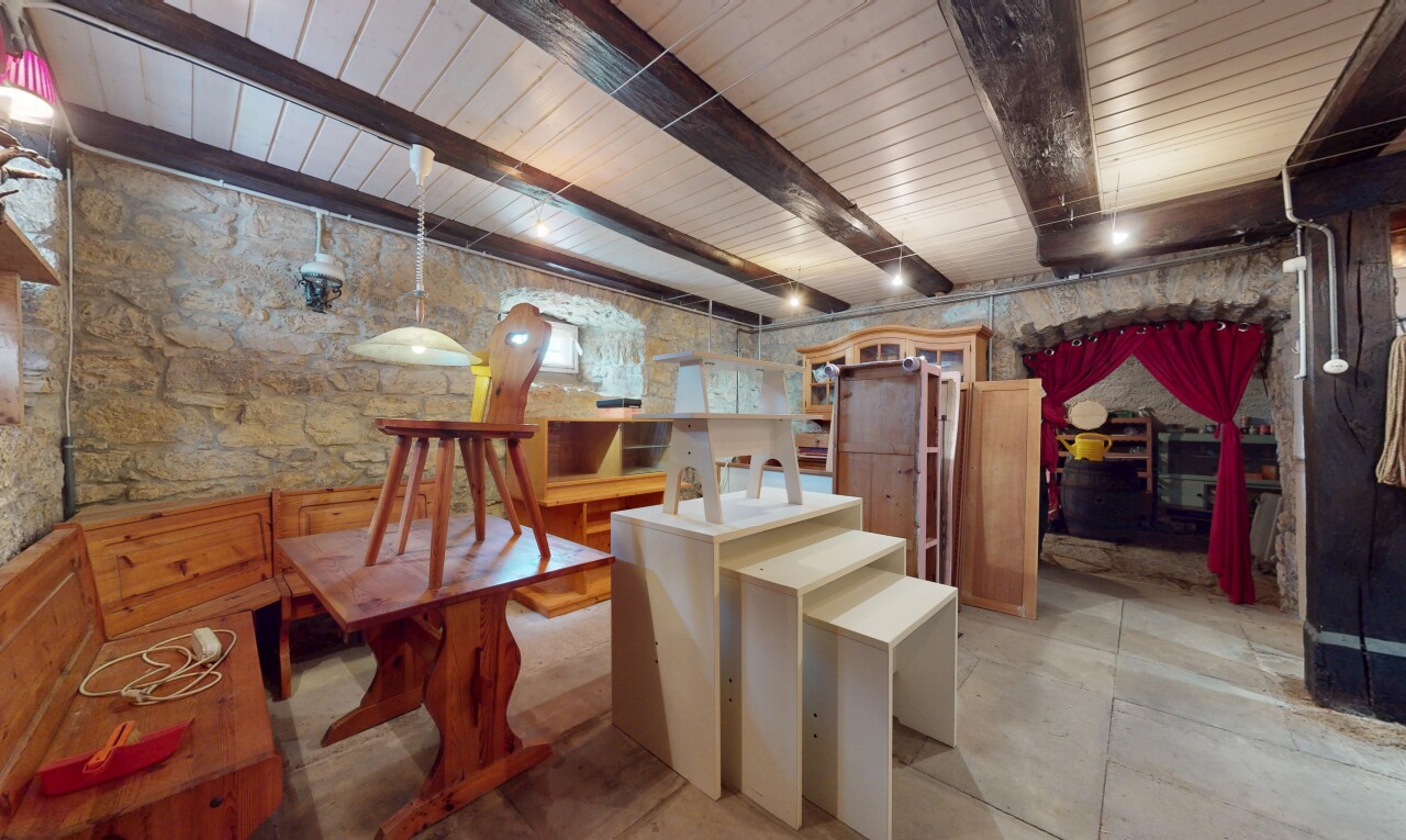 dining room featuring beamed ceiling