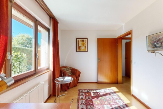 hall with radiator and light wood-style flooring