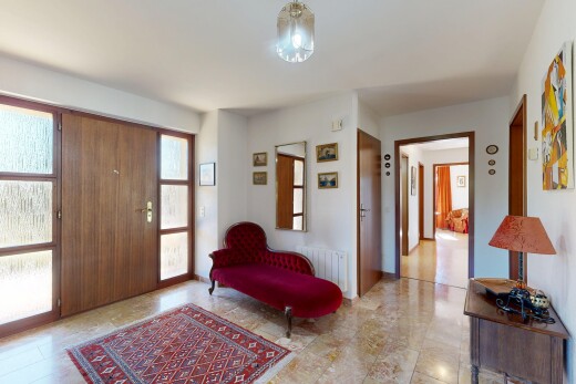 hallway with access to outside and radiator heating unit