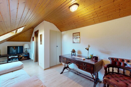 living area with a vaulted wood ceiling, light wood finished floors, and a closet