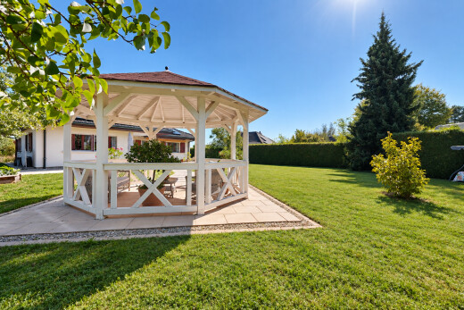 outdoor house with a patio, a yard, and a gazebo