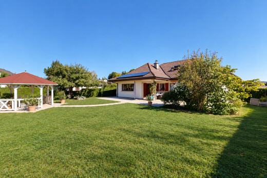 garden with solar panels, a lawn, and a gazebo