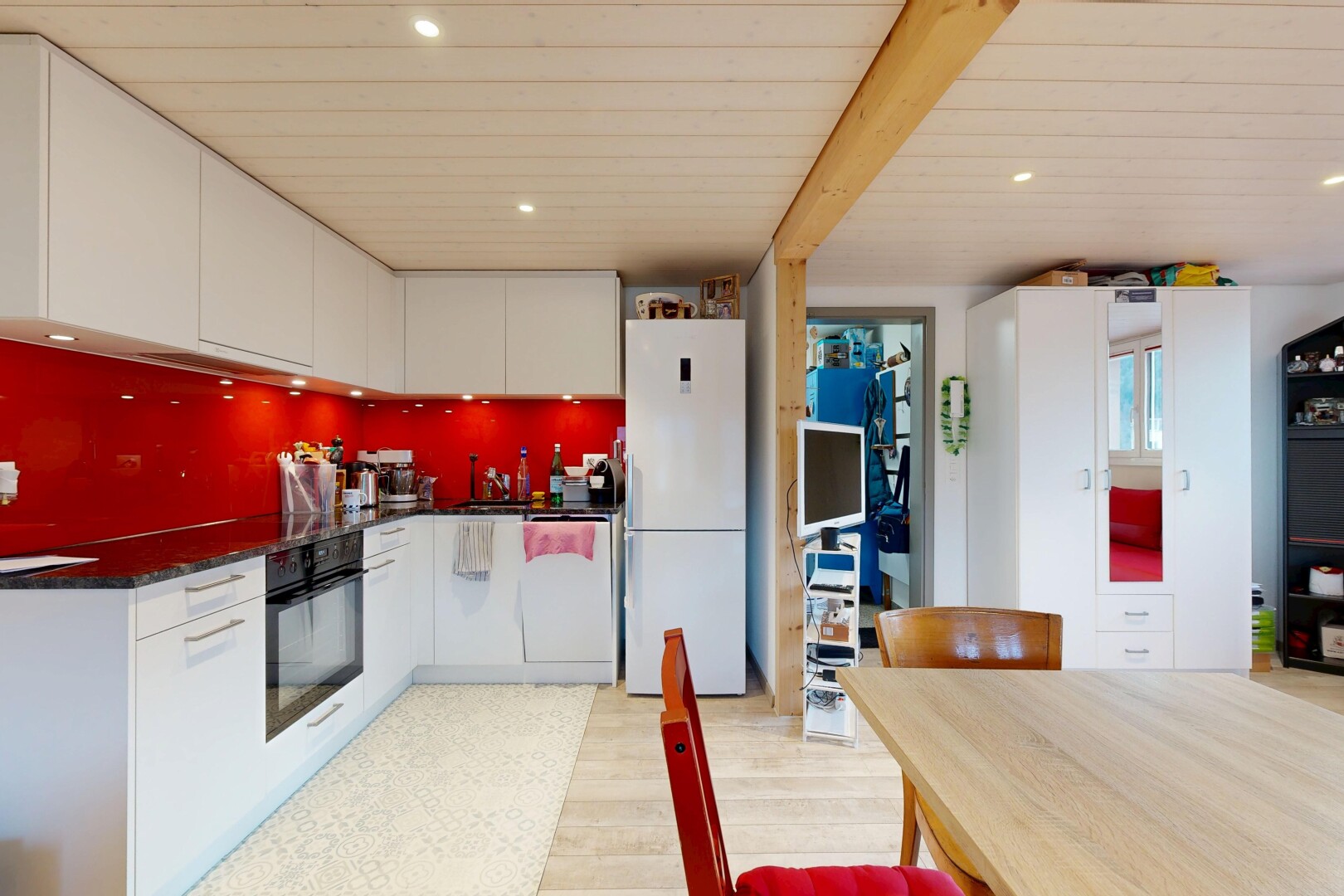kitchen with white cabinetry, white appliances, recessed lighting, light wood finished floors, and beamed ceiling