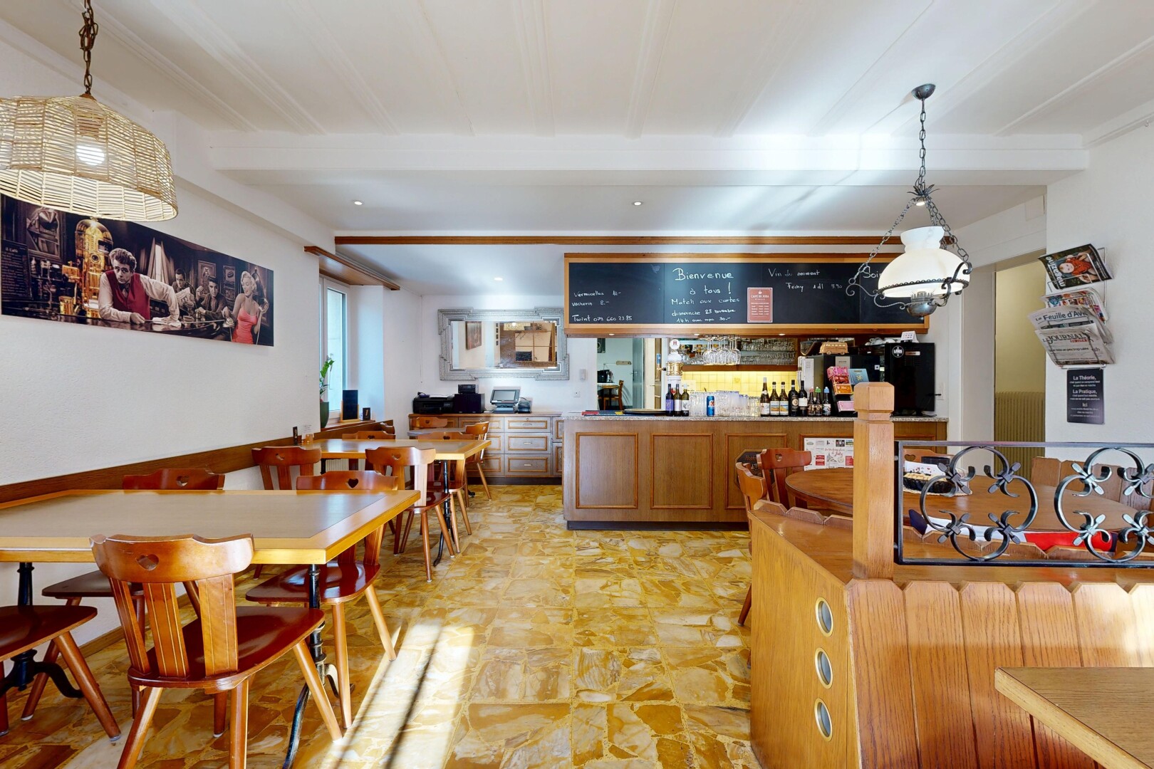 dining space featuring a community bar and beamed ceiling