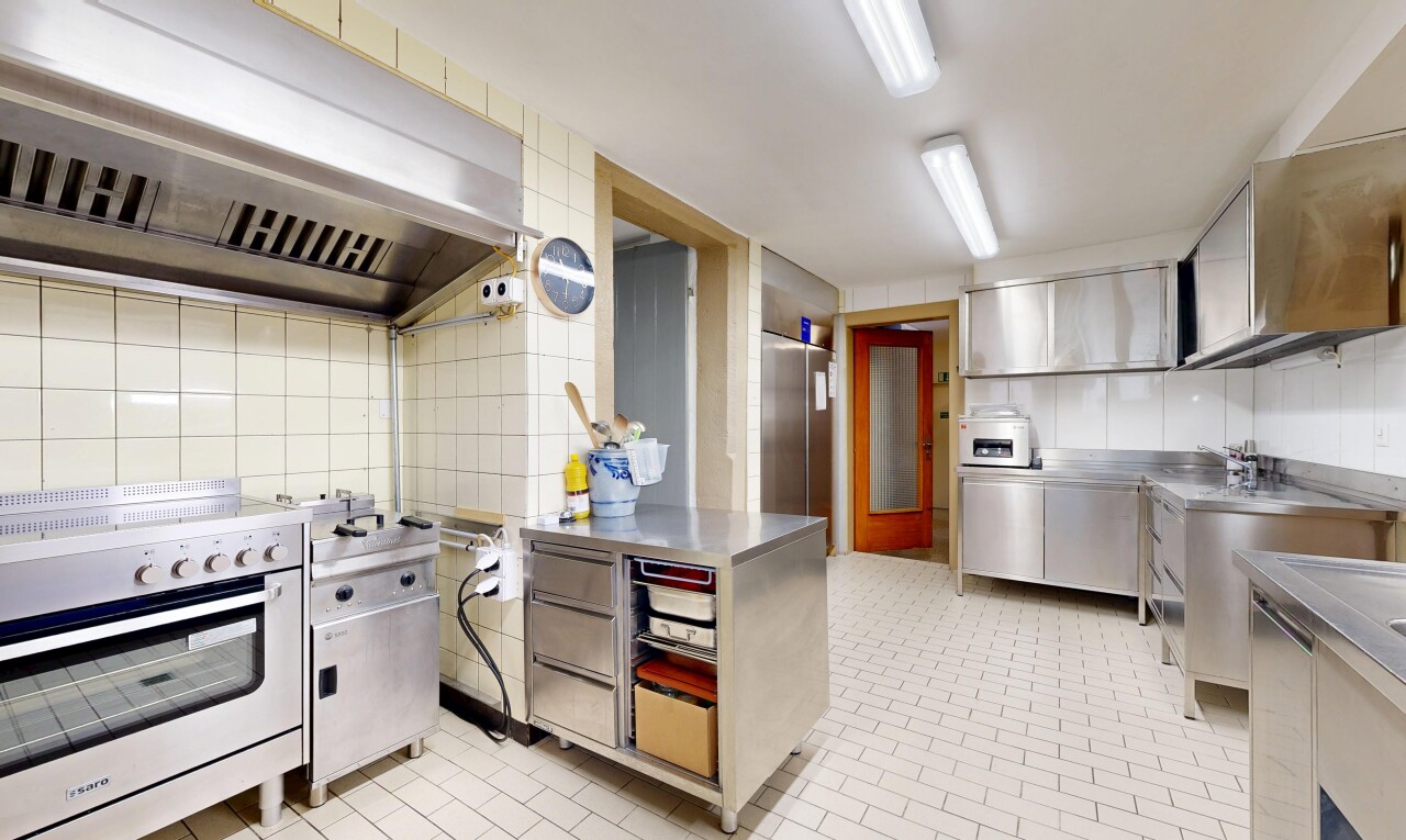 kitchen featuring stainless steel counters, under cabinet range hood, and premium appliances
