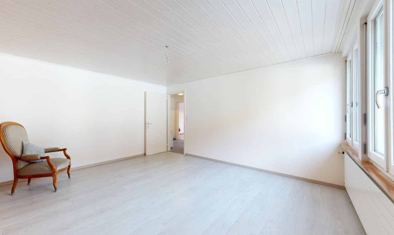 spare room with light wood-style floors and baseboards
