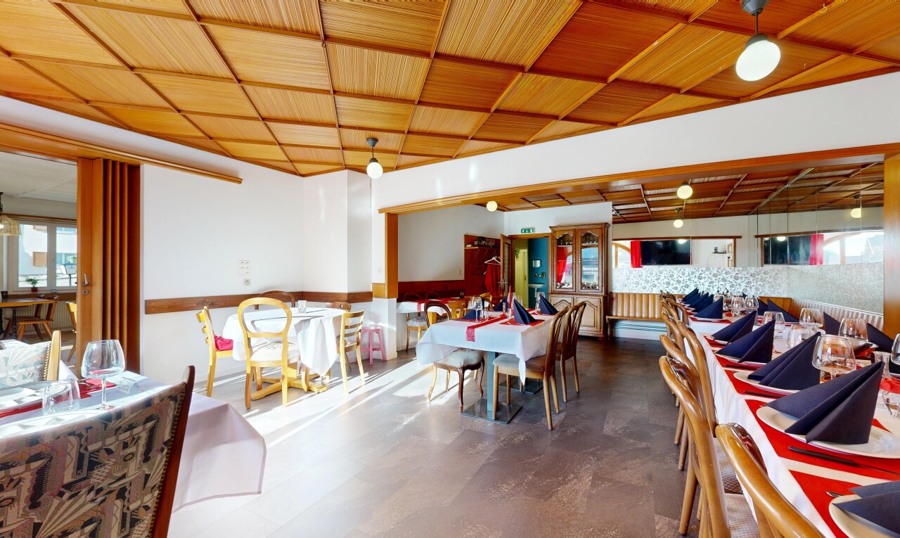 dining space with healthy amount of natural light and concrete floors
