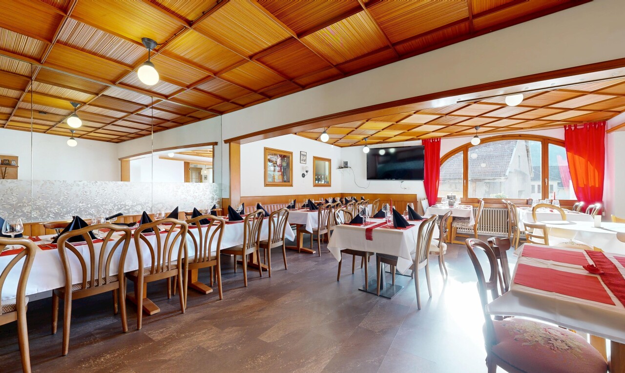 dining area featuring concrete floors