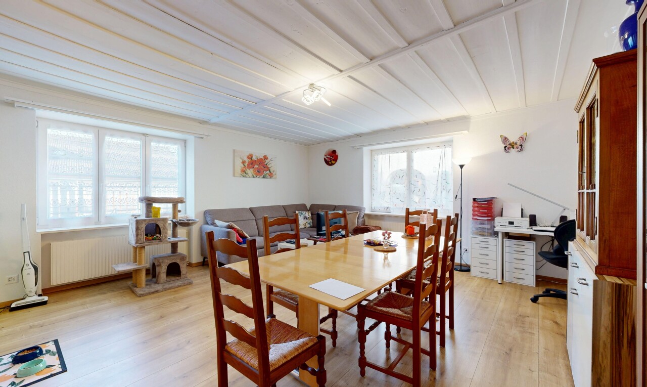 dining room with light wood-style floors and radiator