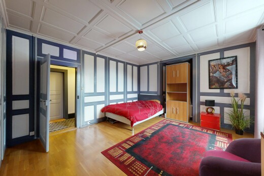 room with a decorative wall and light wood-style floors