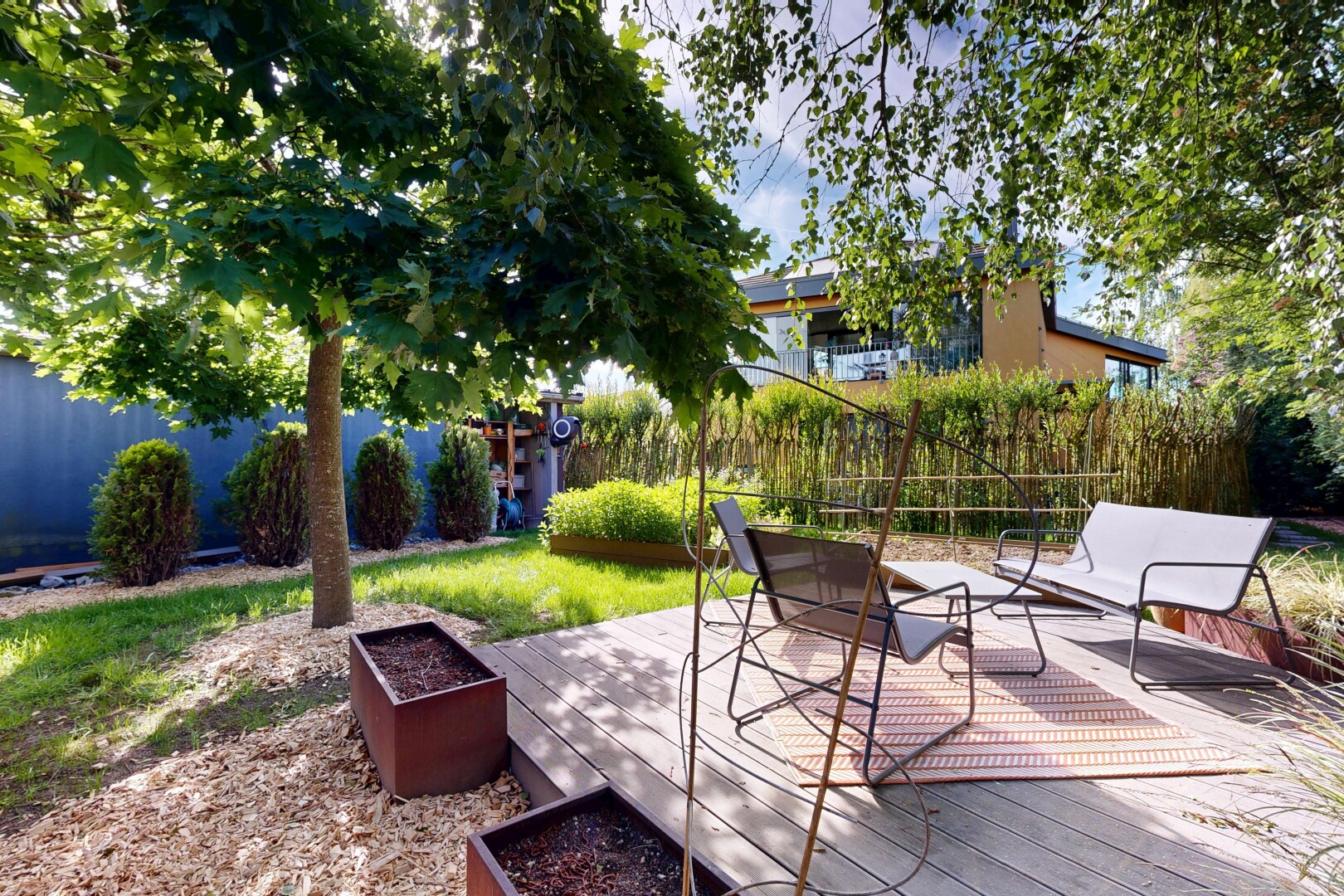 view of wooden terrace featuring a fenced backyard