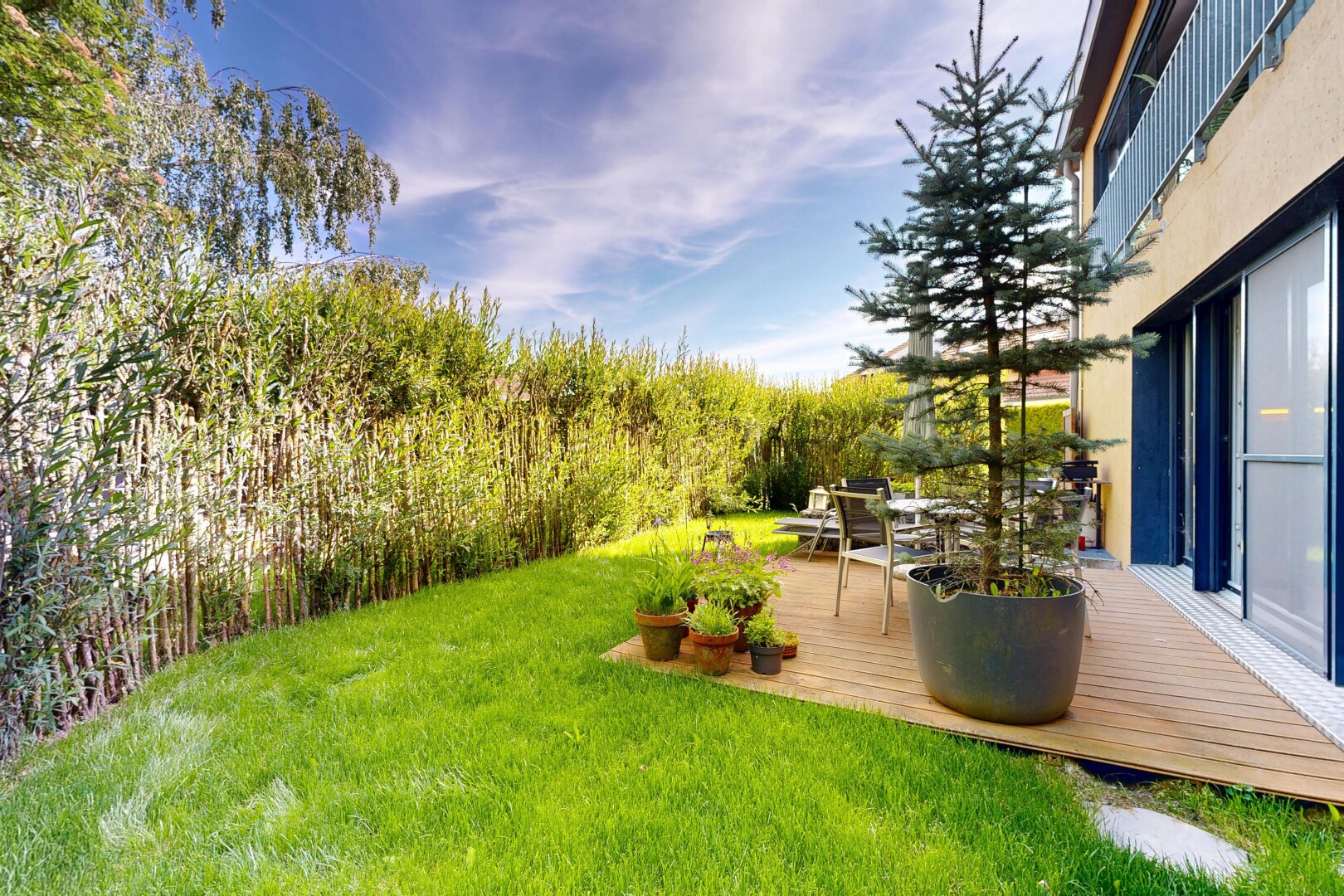 garden featuring a yard and a deck