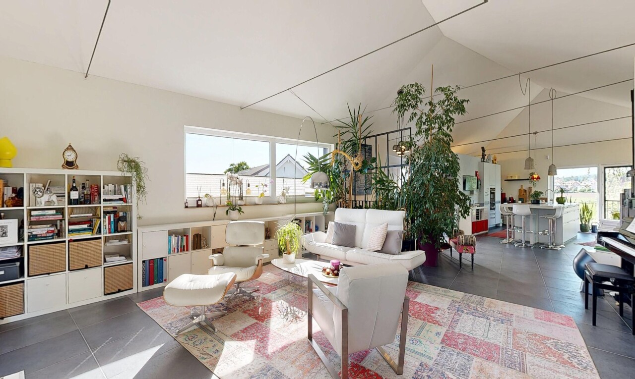 living room featuring a high ceiling