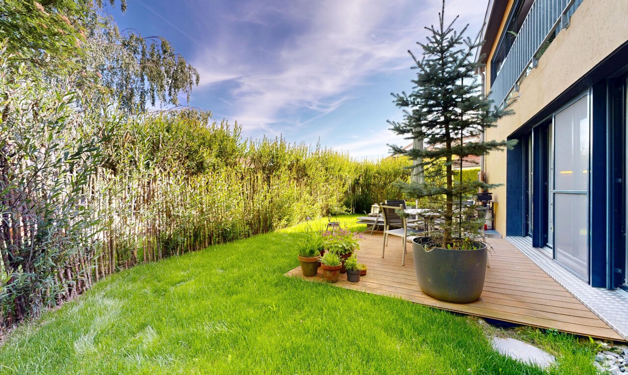 garden featuring a yard and a deck