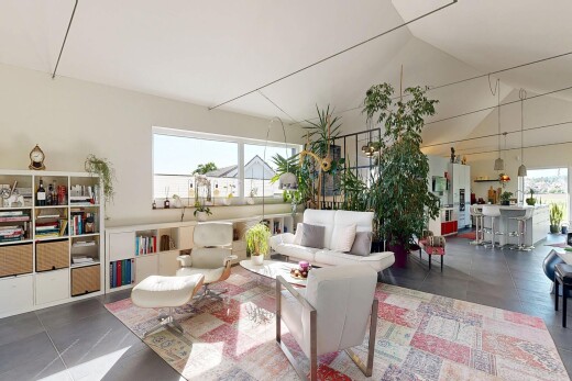 living room featuring a high ceiling