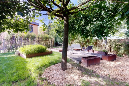 garden featuring a patio and a lawn