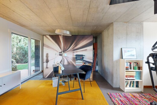 dining room featuring concrete flooring and a desk