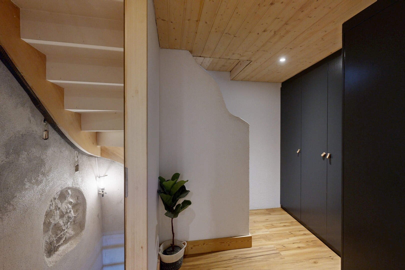 hallway with light wood finished floors, recessed lighting, and wooden ceiling