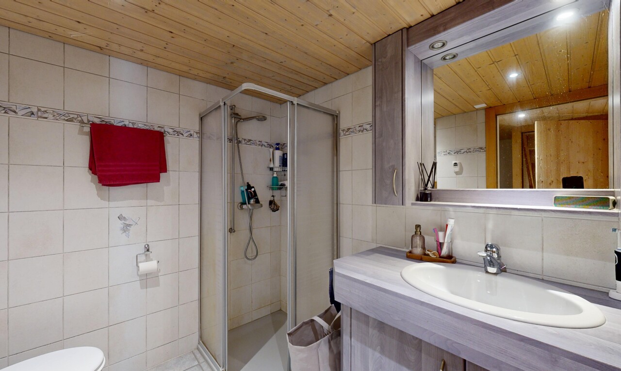 full bathroom with tile walls, a stall shower, vanity, wooden ceiling, and recessed lighting