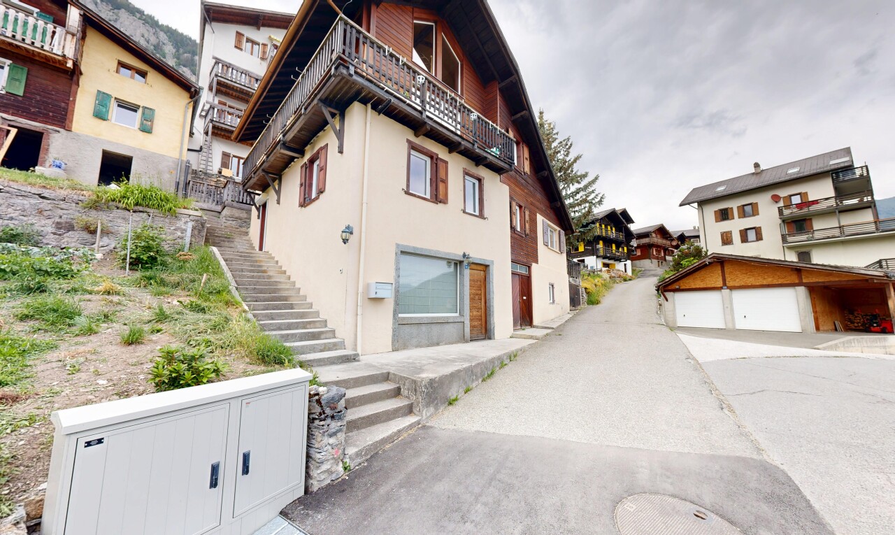view of property featuring stairs