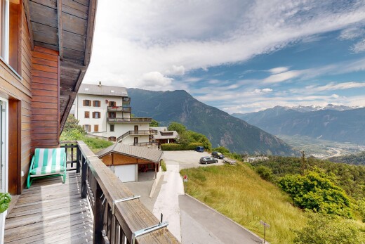 balcony featuring a mountain view