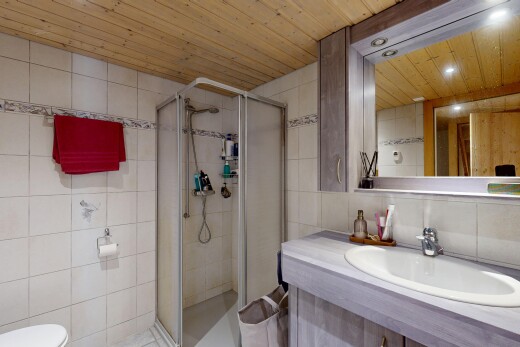 full bathroom with tile walls, a stall shower, vanity, wooden ceiling, and recessed lighting