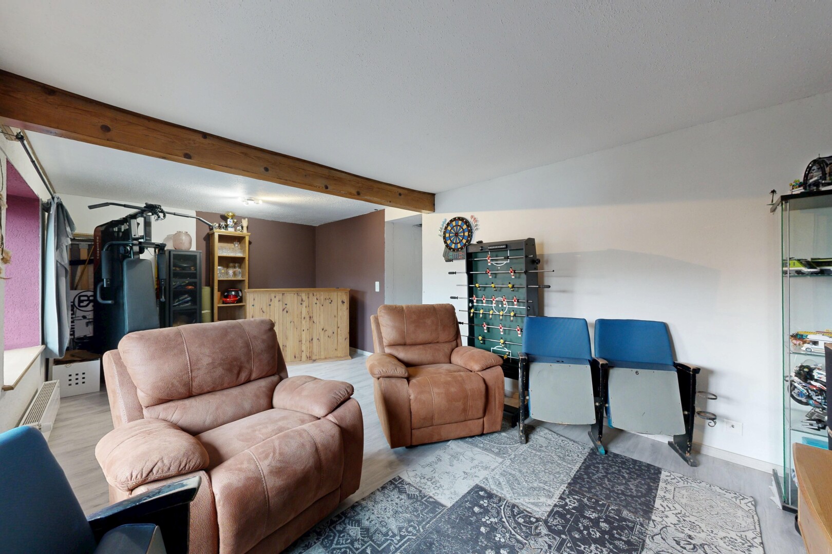 living area featuring beam ceiling