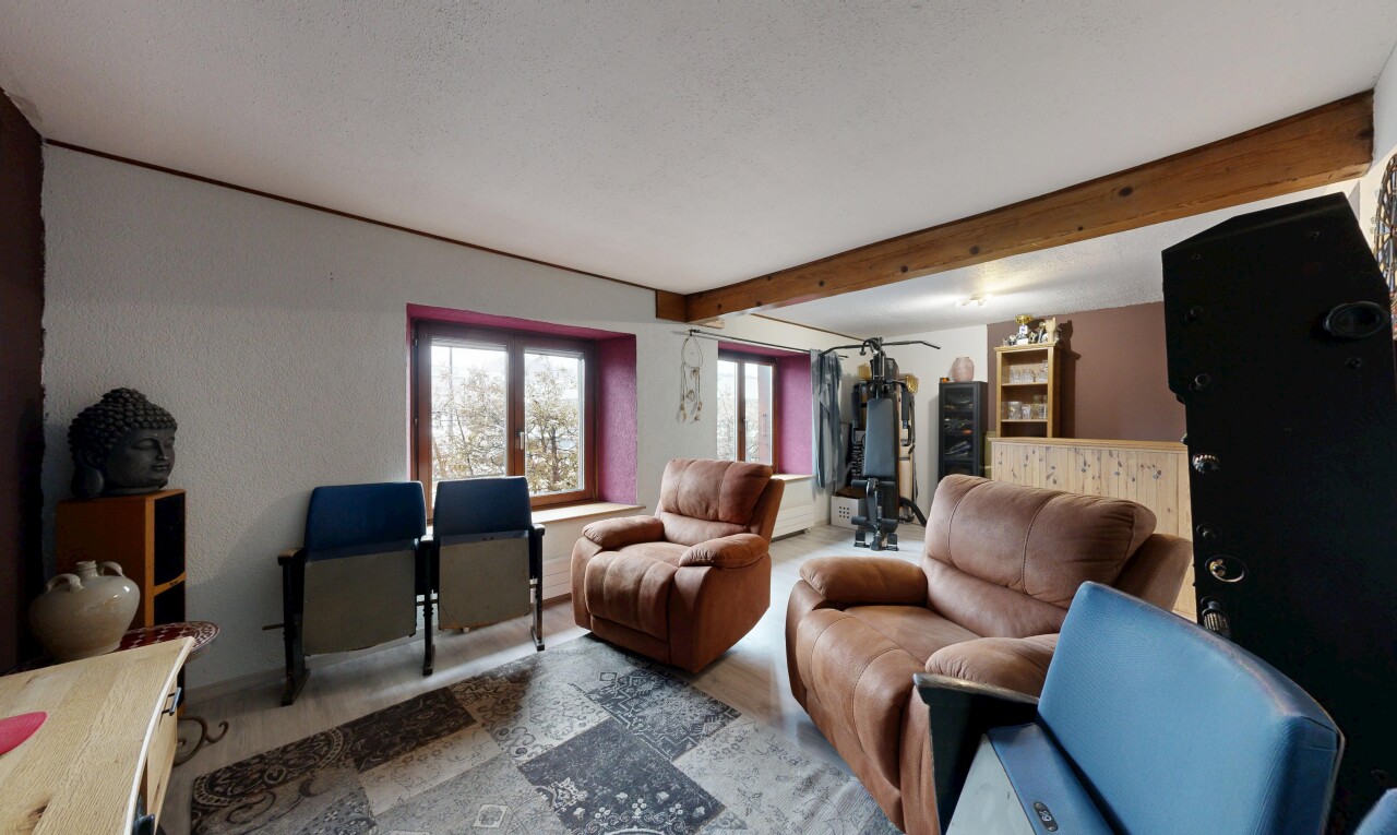 living room with beamed ceiling
