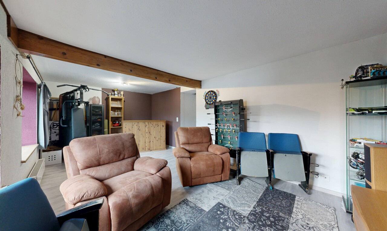 living area featuring beam ceiling
