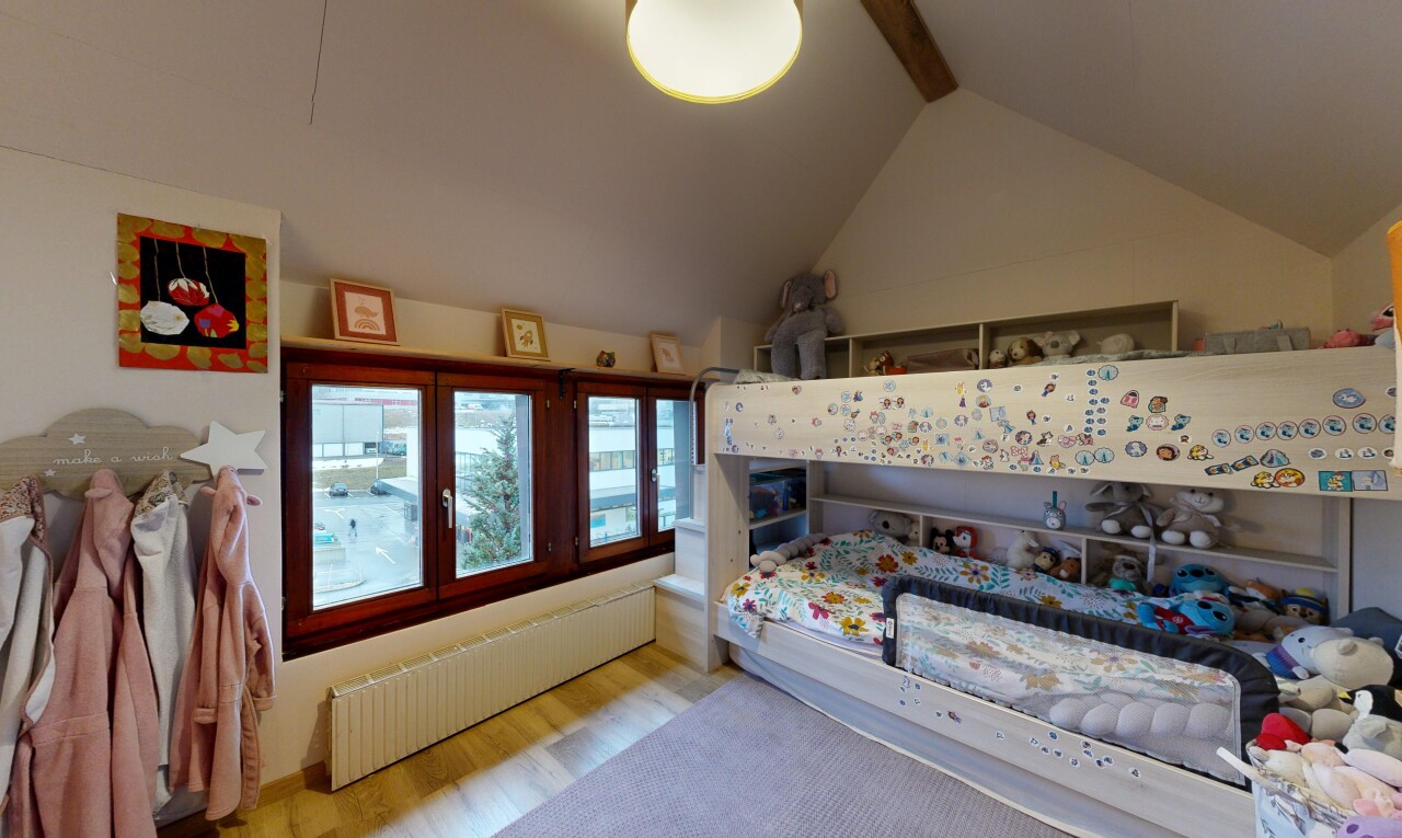 room with radiator and wood finished floors