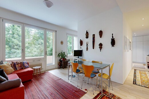 living area featuring light wood-style flooring and radiator heating unit