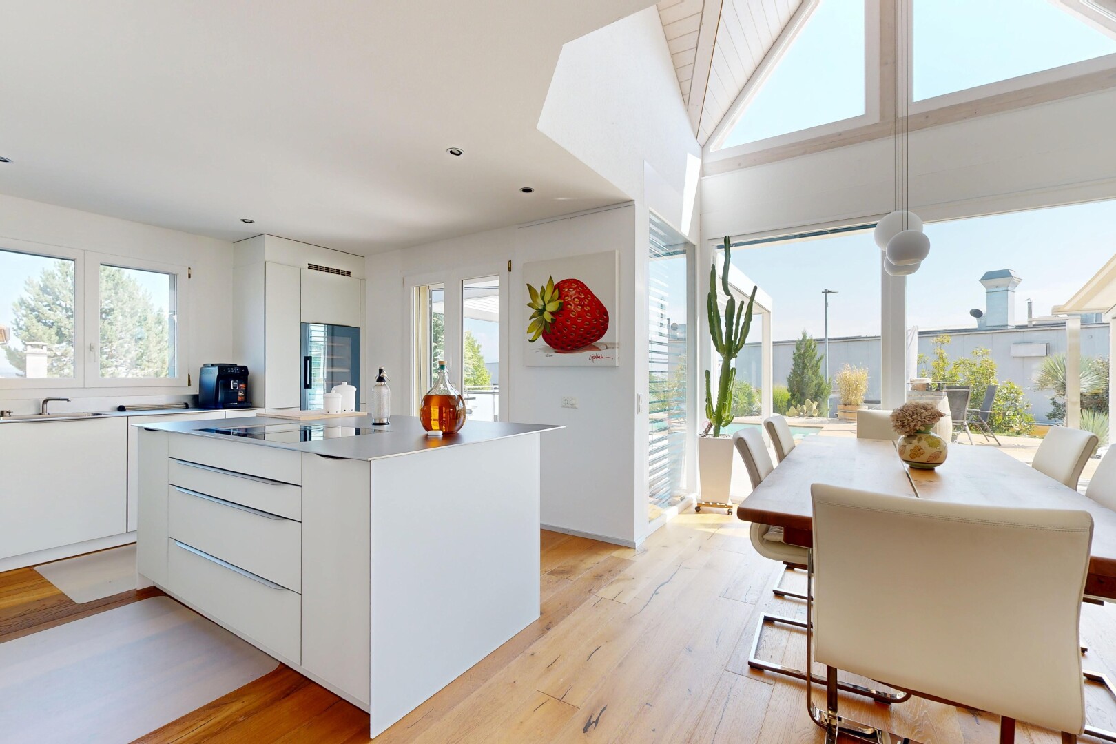 cuisine avec flat panel cabinets, armoires à panneau plat, light floor, wood finish floor, et sol en finition bois