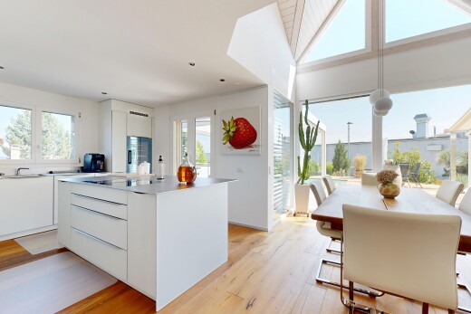 cuisine avec flat panel cabinets, armoires à panneau plat, light floor, wood finish floor, et sol en finition bois