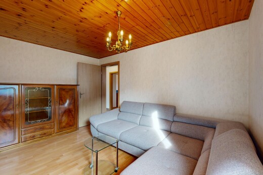 living room with light wood finished floors, wooden ceiling, and hanging lights