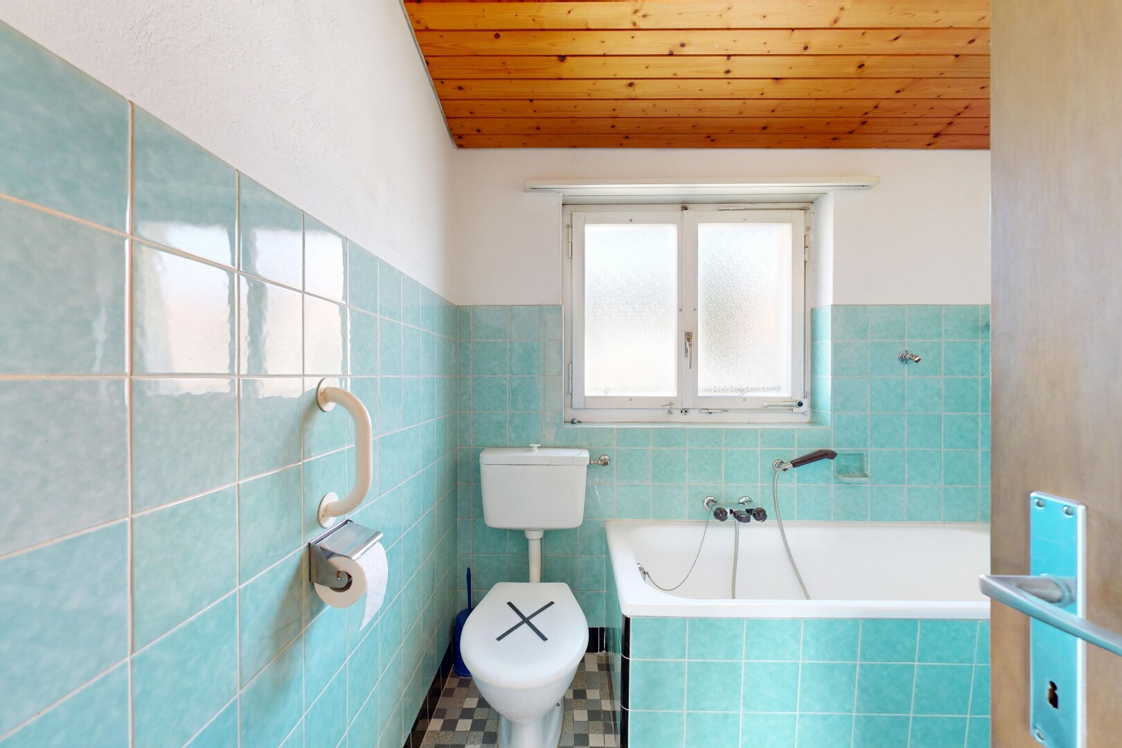 full bath with a garden tub, a vaulted wooden ceiling, tile walls, and a wainscoted wall
