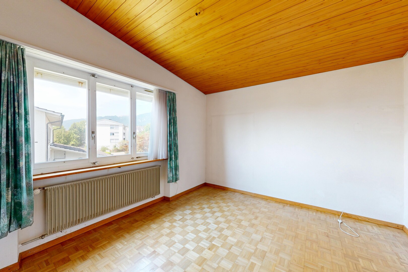 unfurnished room with radiator heating unit, a vaulted wooden ceiling, and parquet floors