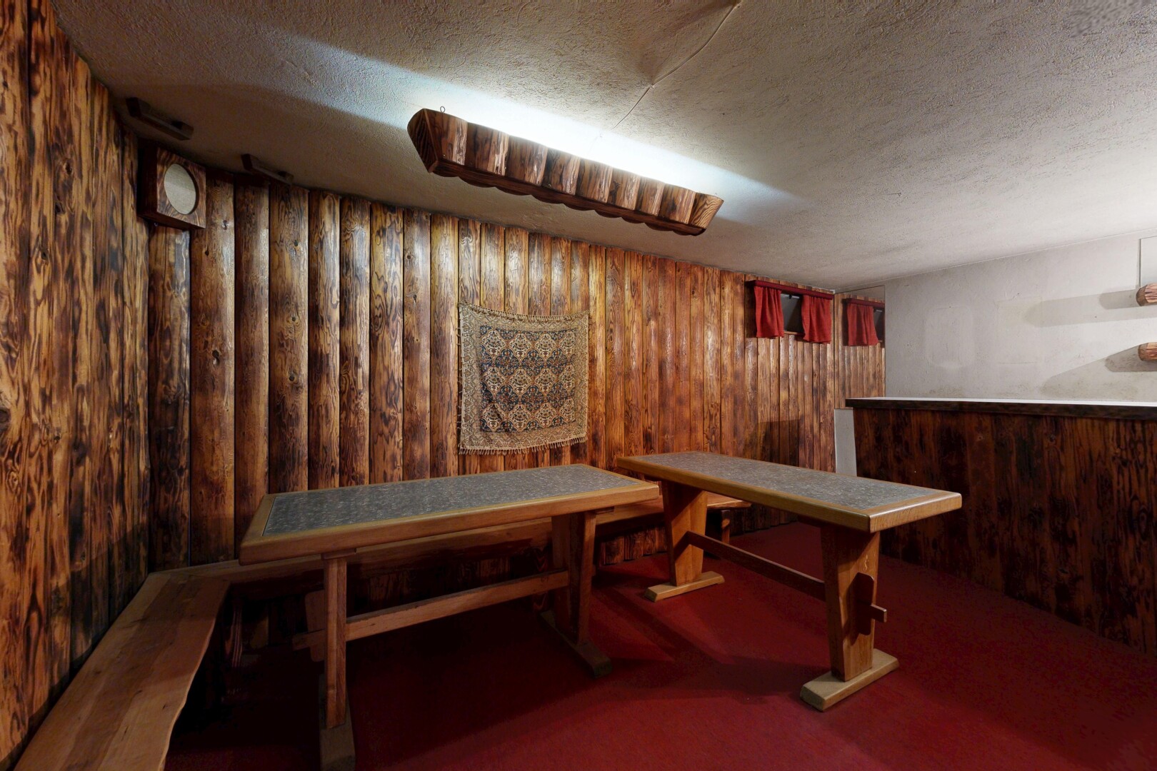 interior space with wood walls and a textured ceiling