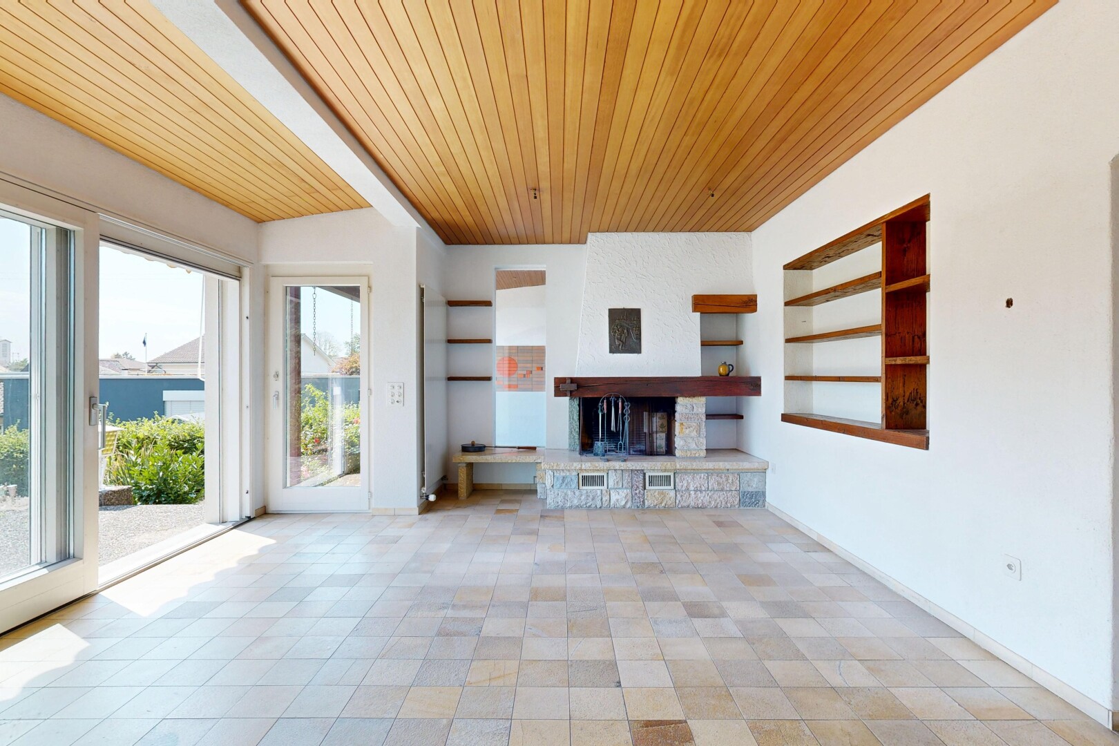 unfurnished living room featuring built in shelves and wood ceiling