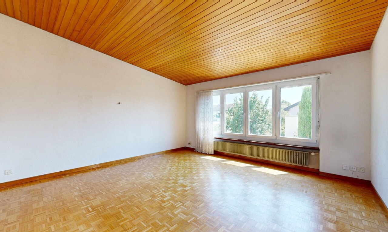 spare room featuring wood ceiling, radiator, and parquet flooring