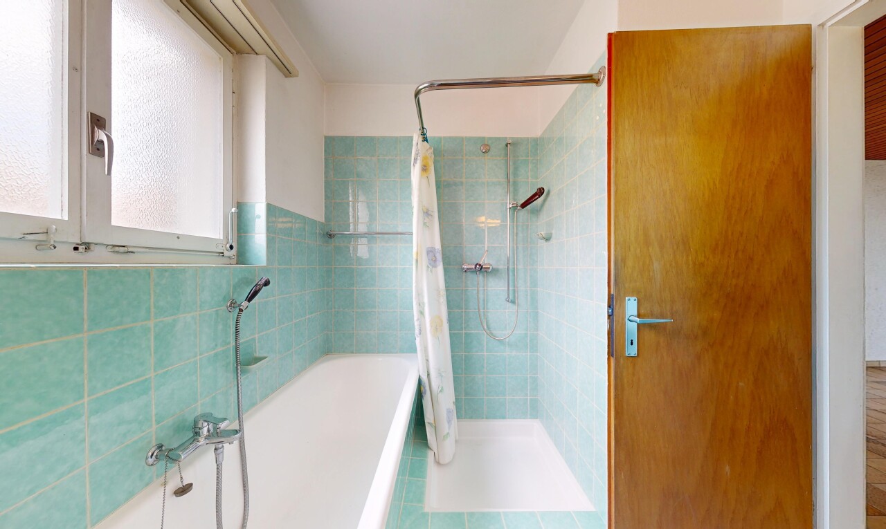 full bathroom with a stall shower, a bath, tile walls, and tile patterned floors