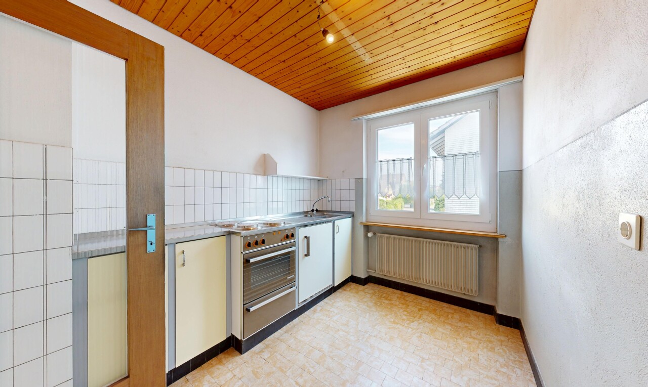 kitchen with wooden ceiling, radiator, decorative backsplash, a warming drawer, and light floors