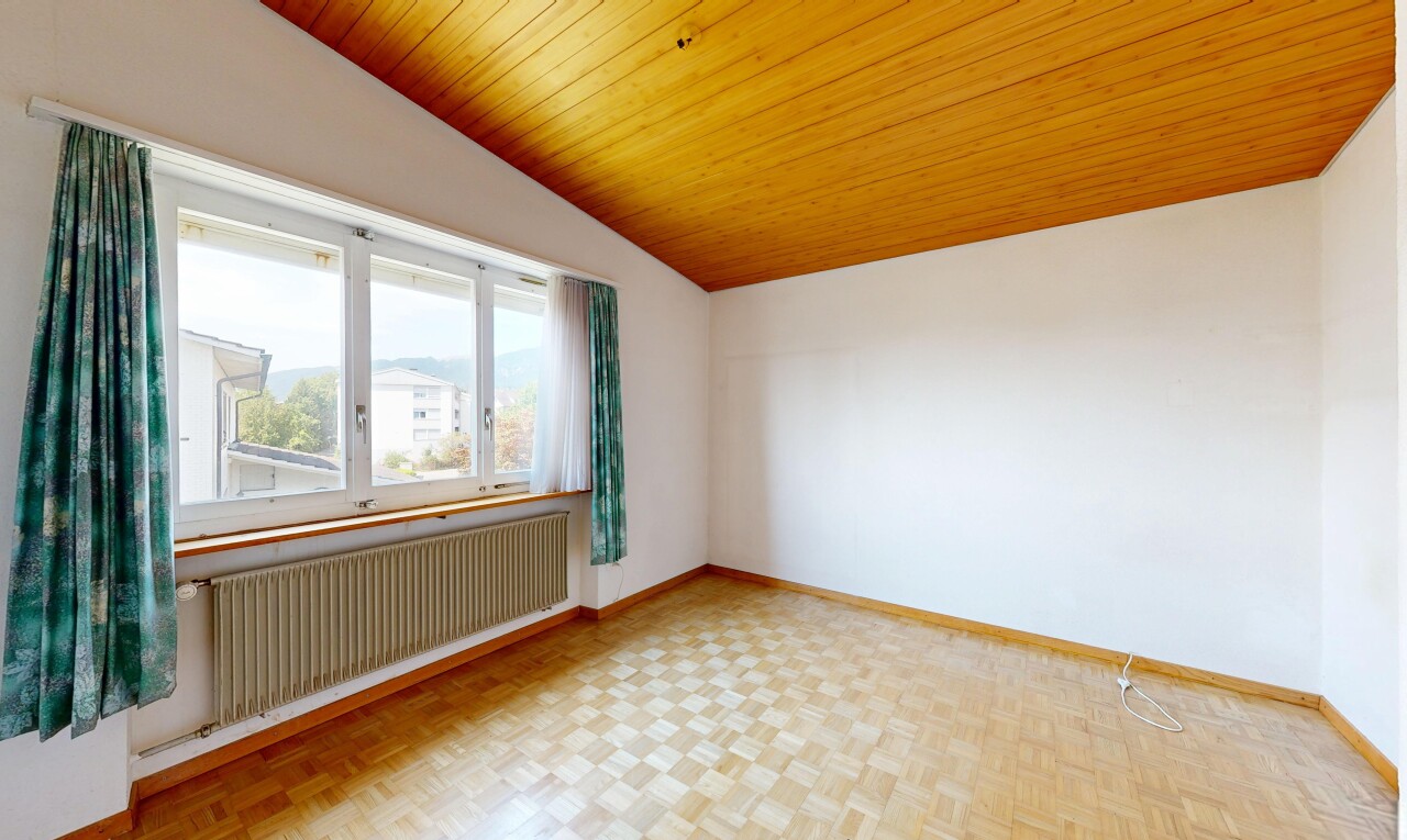 unfurnished room with radiator heating unit, a vaulted wooden ceiling, and parquet floors