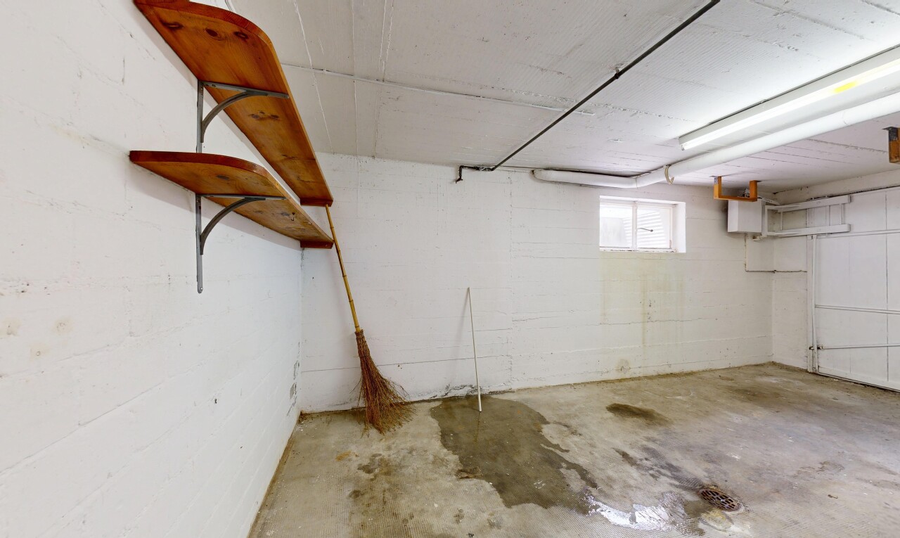 spare room with unfinished concrete floors